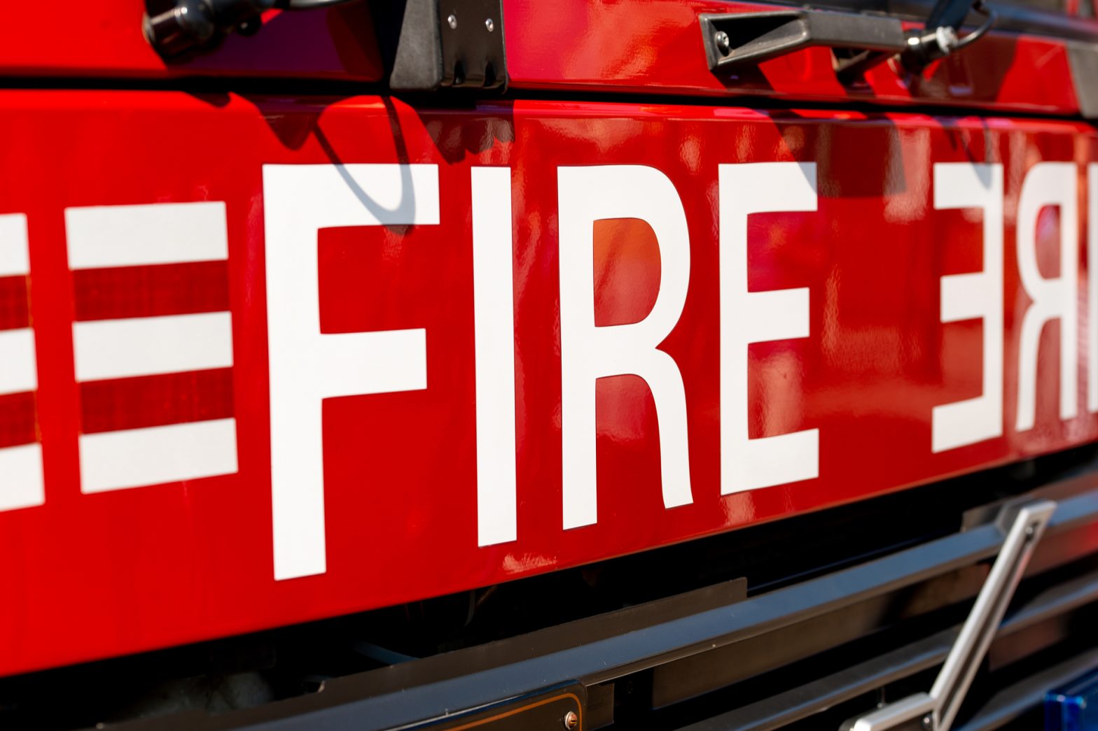 close up on the word Fire on the front of a fire engine