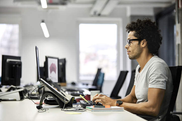 Man working on a computer in an office environment