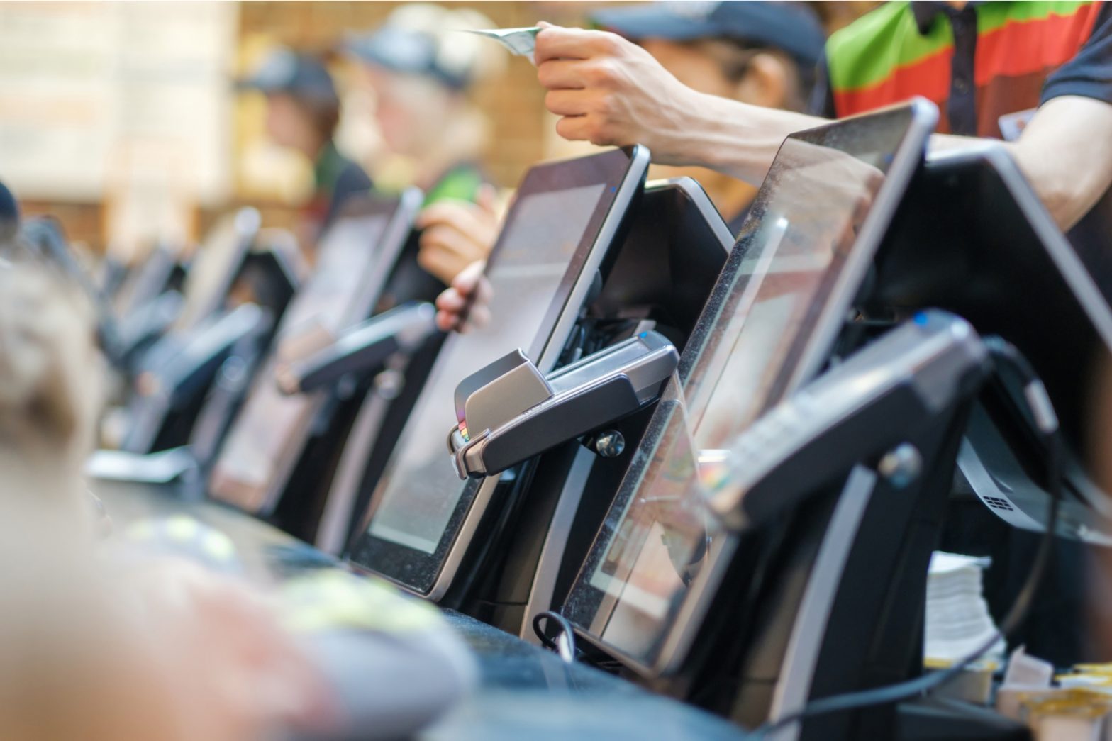 a row of point of sales terminals (card machines)