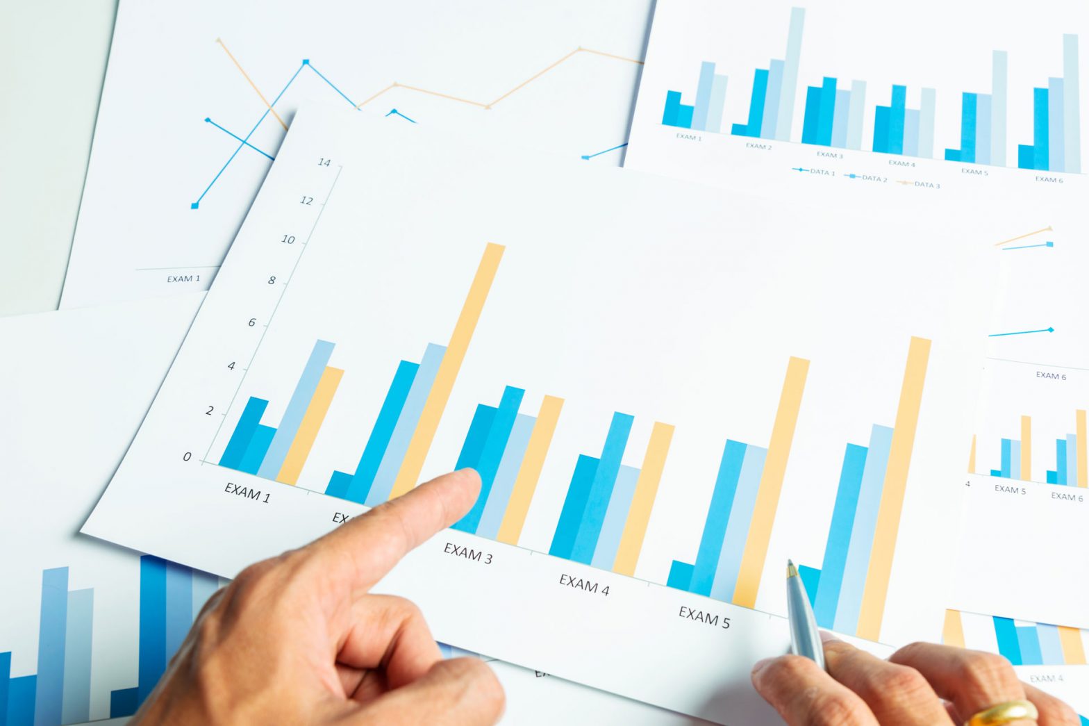 Man pointing at business report