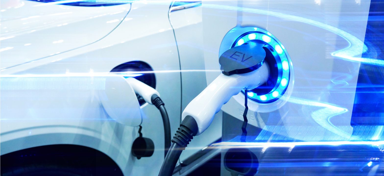 Electric car plugged into a charging point