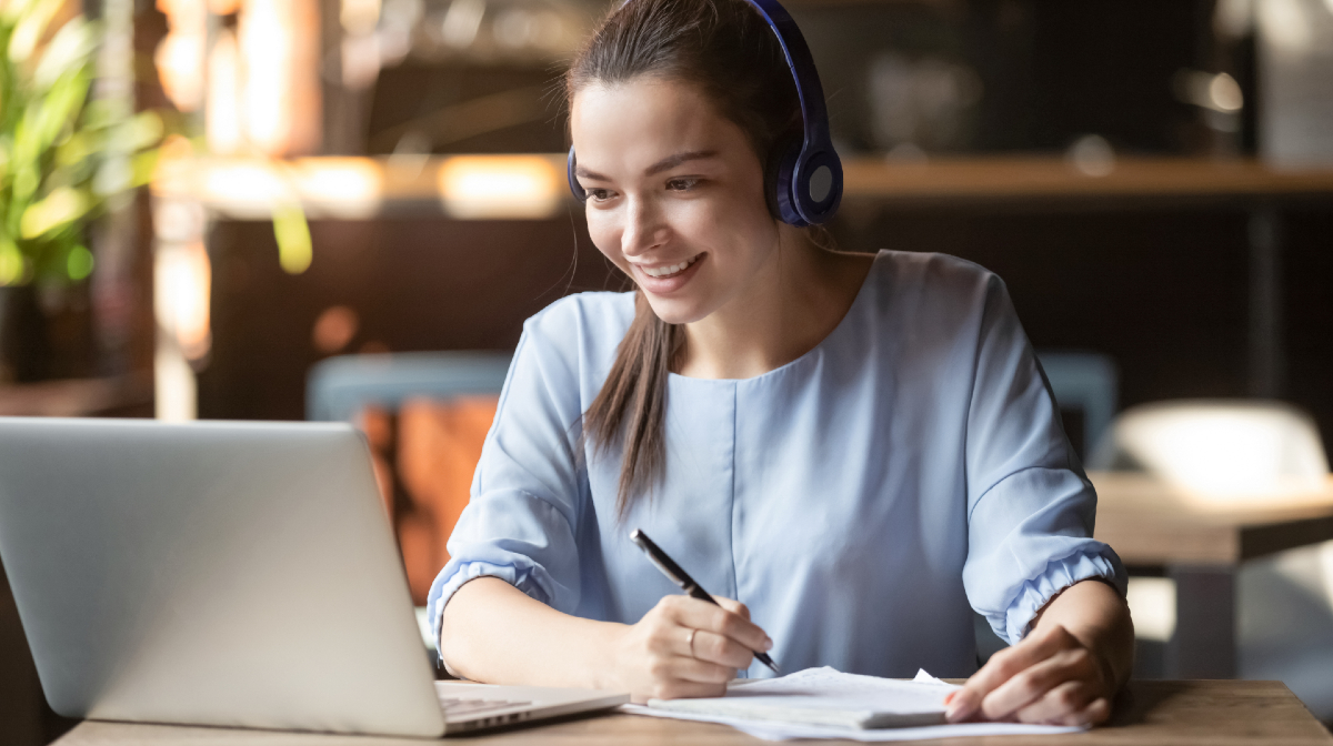 Woman at desk on call