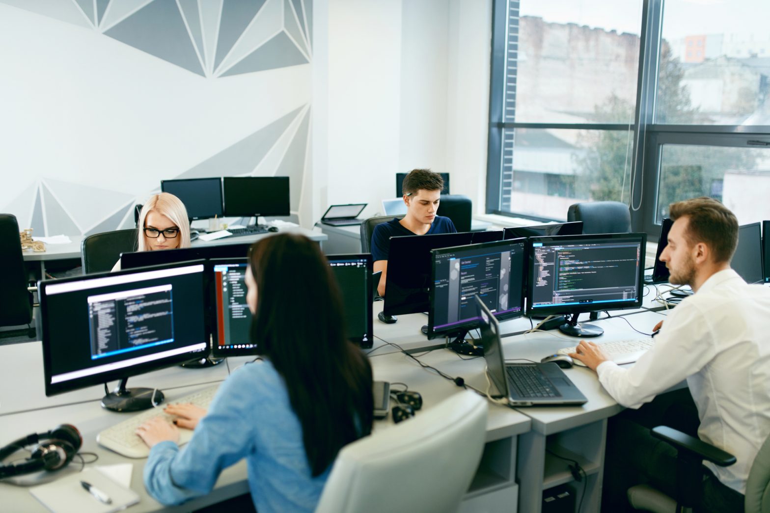 an office with people sat at computers