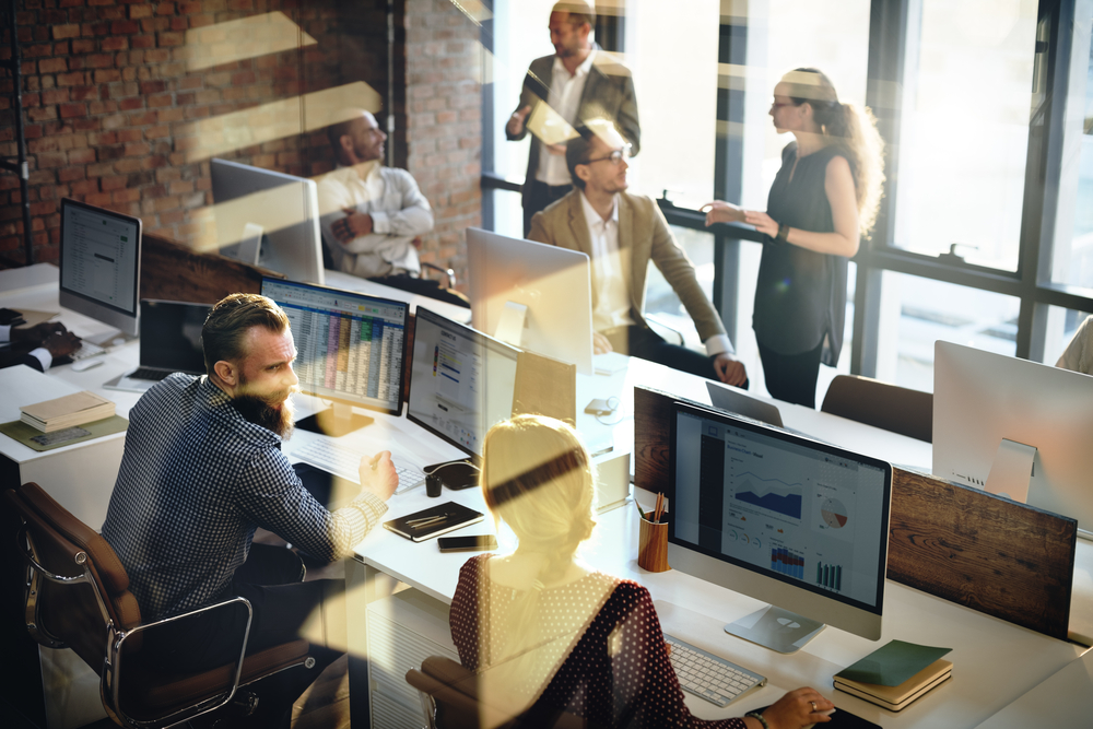 Business colleagues in modern open plan office