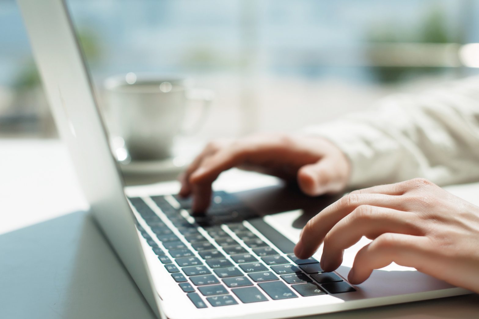 person typing on laptop