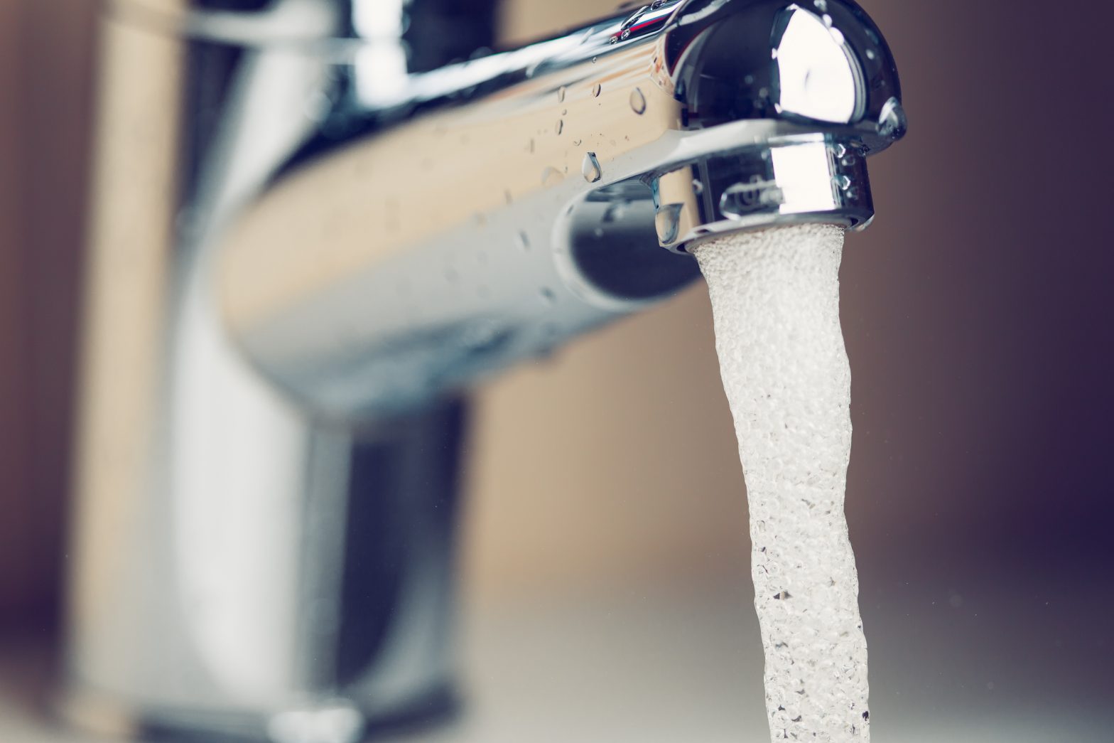 Close up of tap with water running out