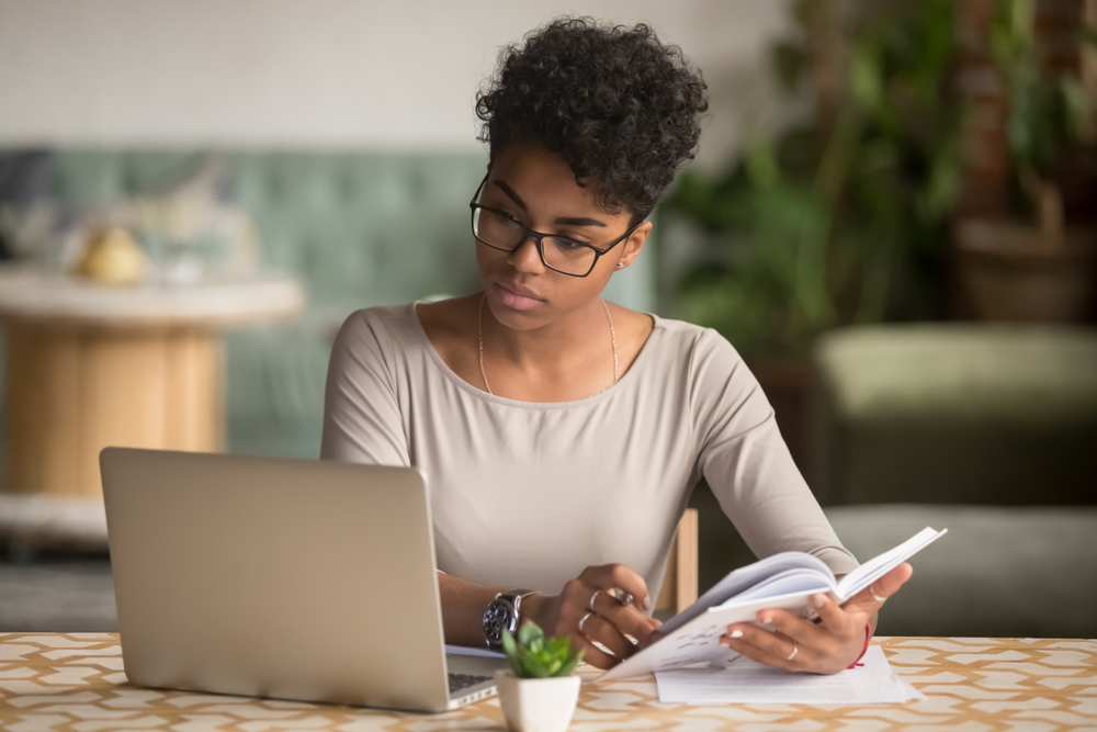 Woman looking at laptop