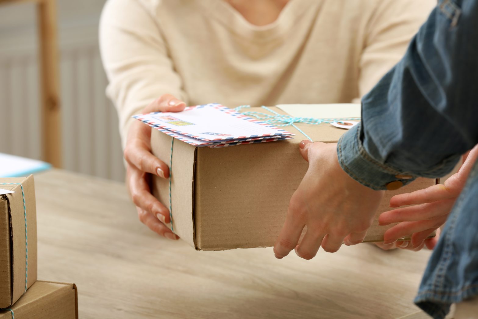 person giving away a parcel