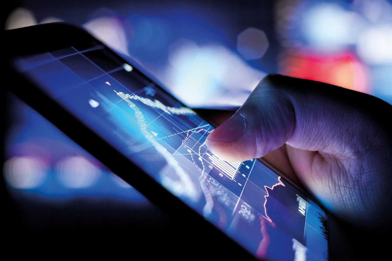 Man looking at report info graphs on mobile phone