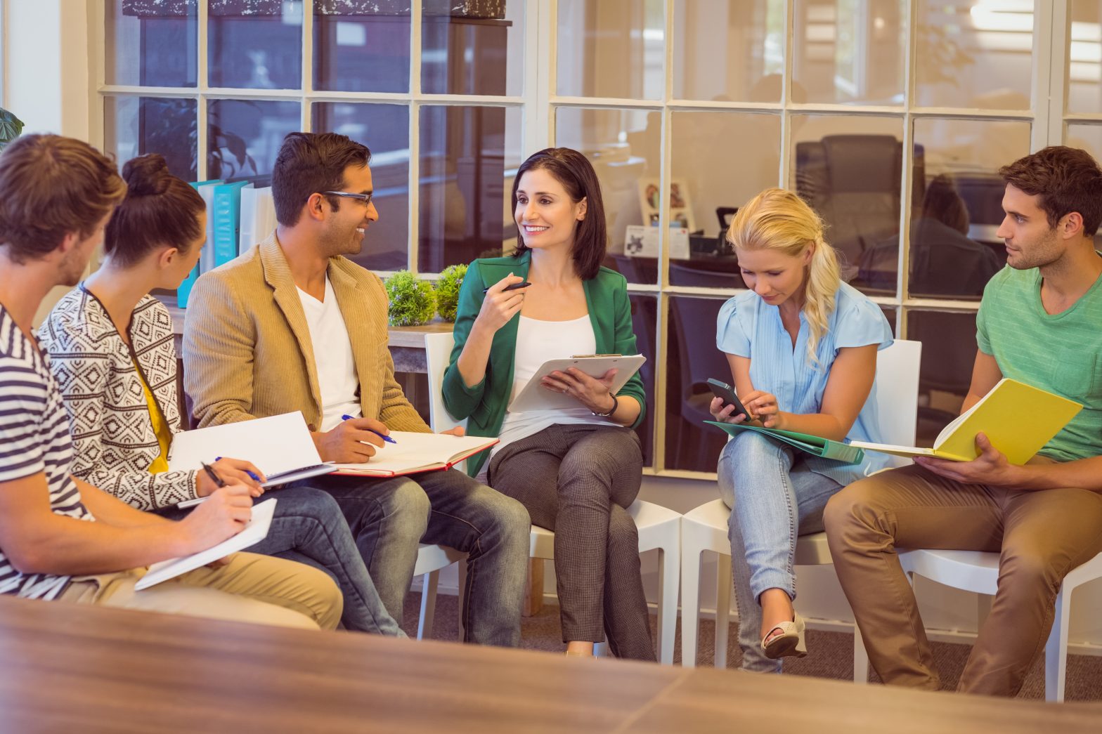 Group of people sitting round a table