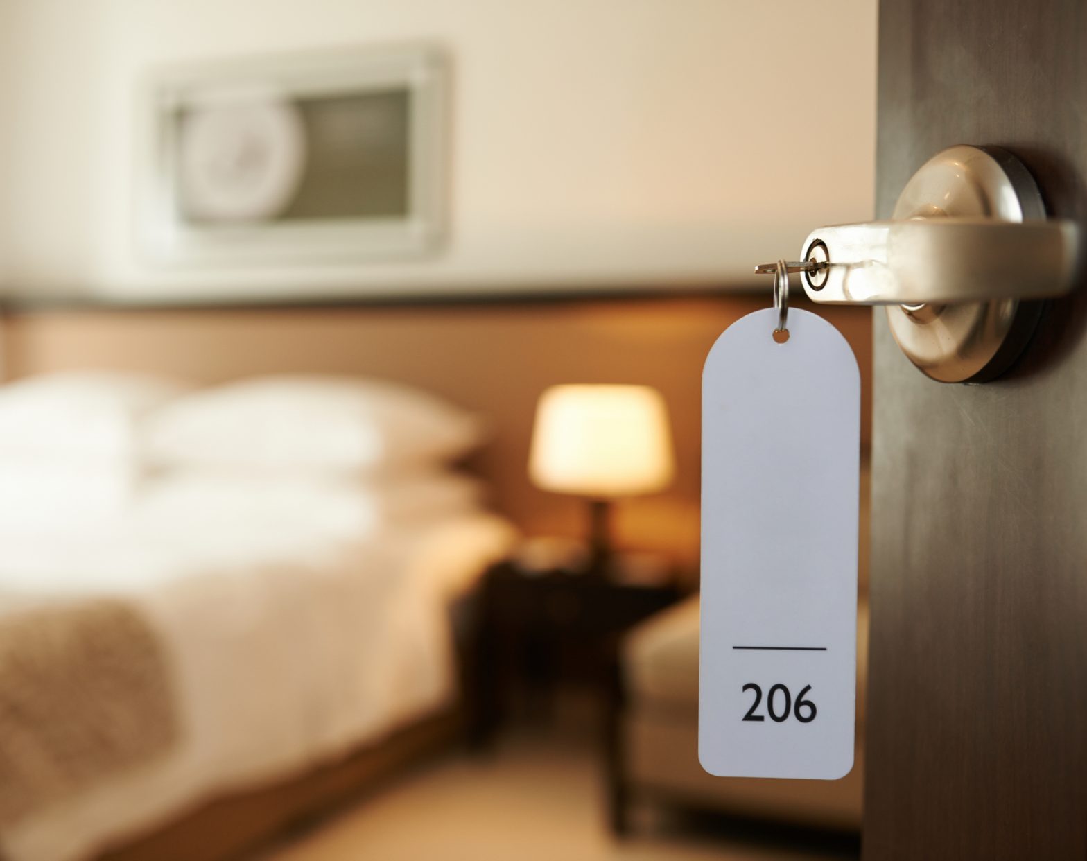 Key in the door of a hotel room