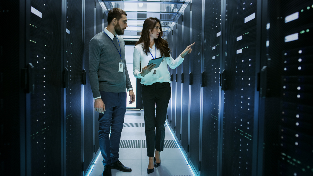 Man and woman in data center