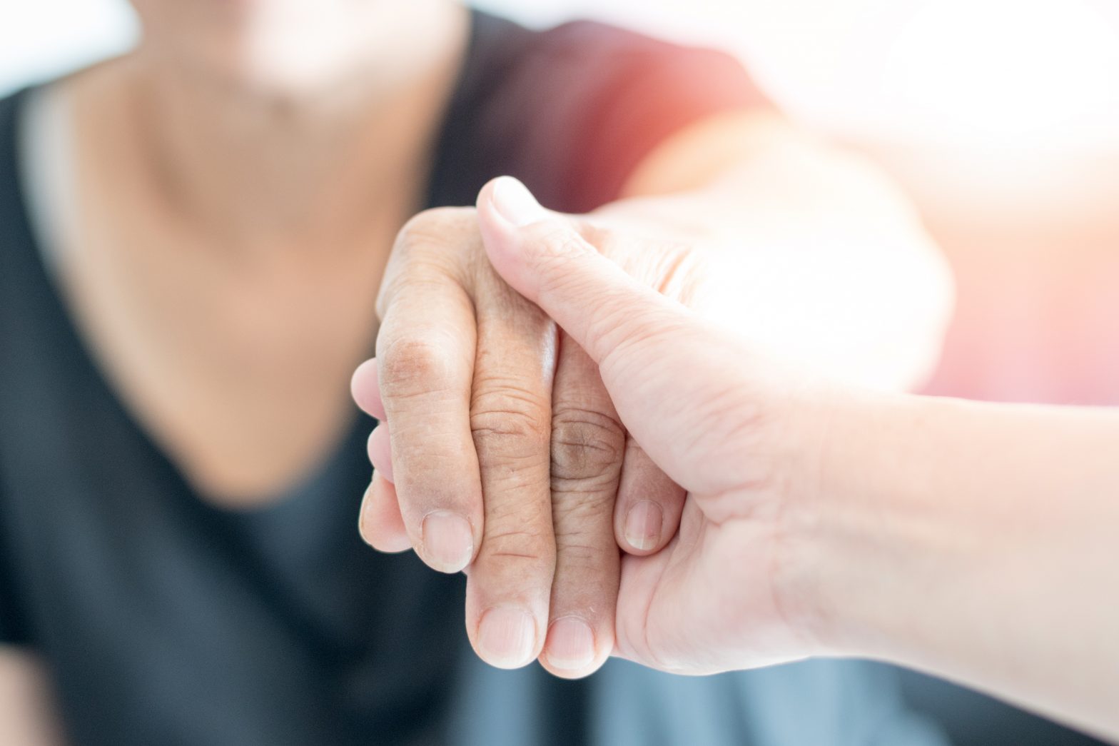 Two people holding hands