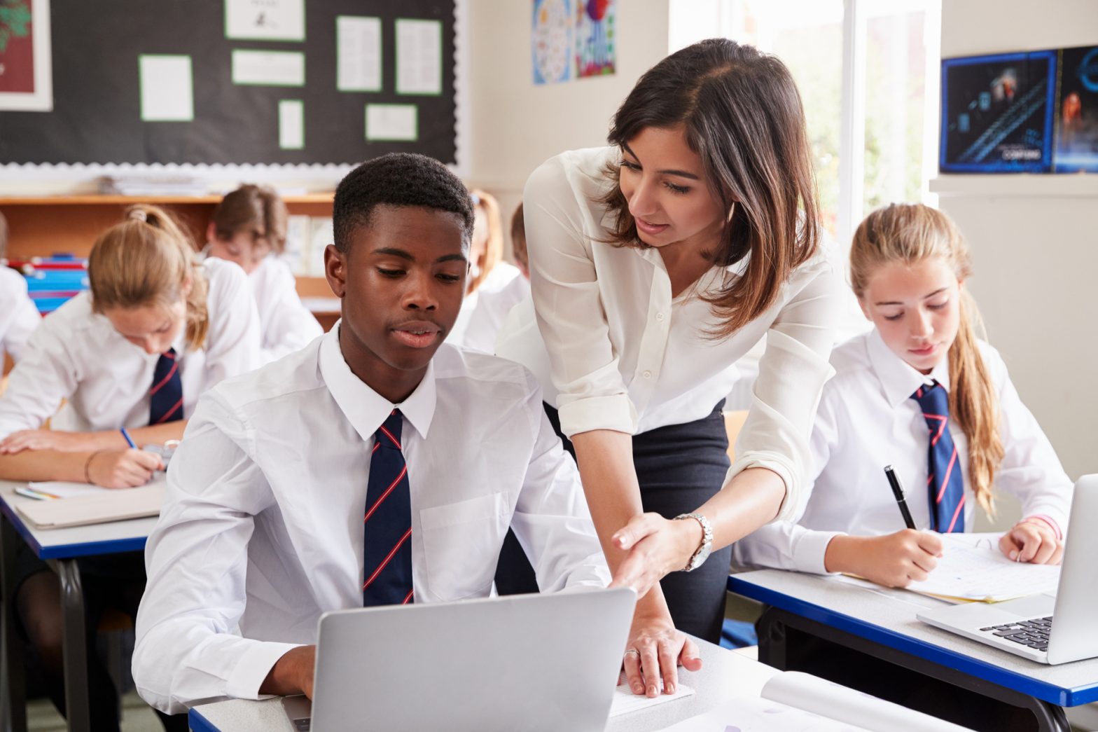 teacher talking to a teenager